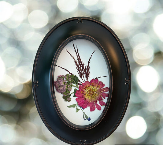 Real pressed flowers in oval frame